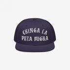 Chinga La Migra Hat: A dark-navy snapback featuring bold white Old English embroidery, symbolizing resistance against ICE, ideal for those advocating immigrant rights and social justice.