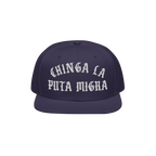 Chinga La Migra Hat: A dark-navy snapback featuring bold white Old English embroidery, symbolizing resistance against ICE, id