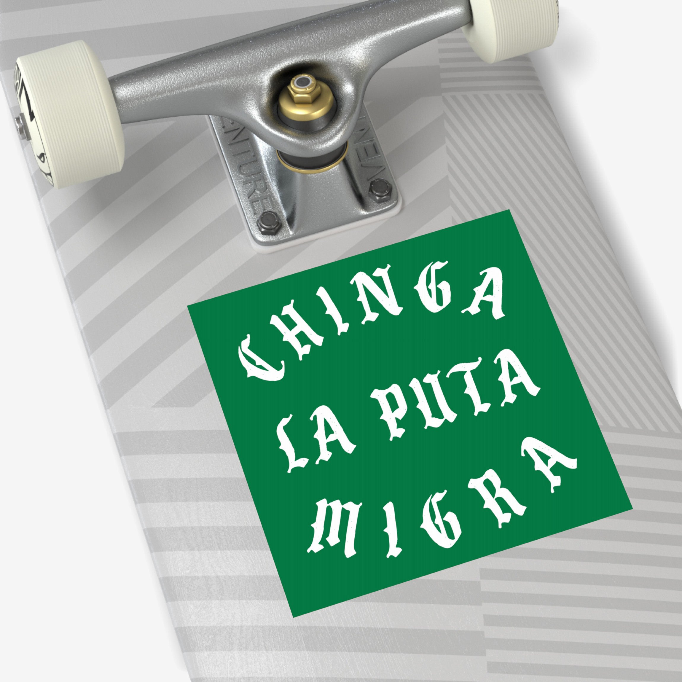 Chinga La Migra Sticker & Magnet displayed on an upside-down skateboard, featuring bold Gothic lettering on a green background, symbolizing anti-fascist protest and immigrant support with a defiant message.