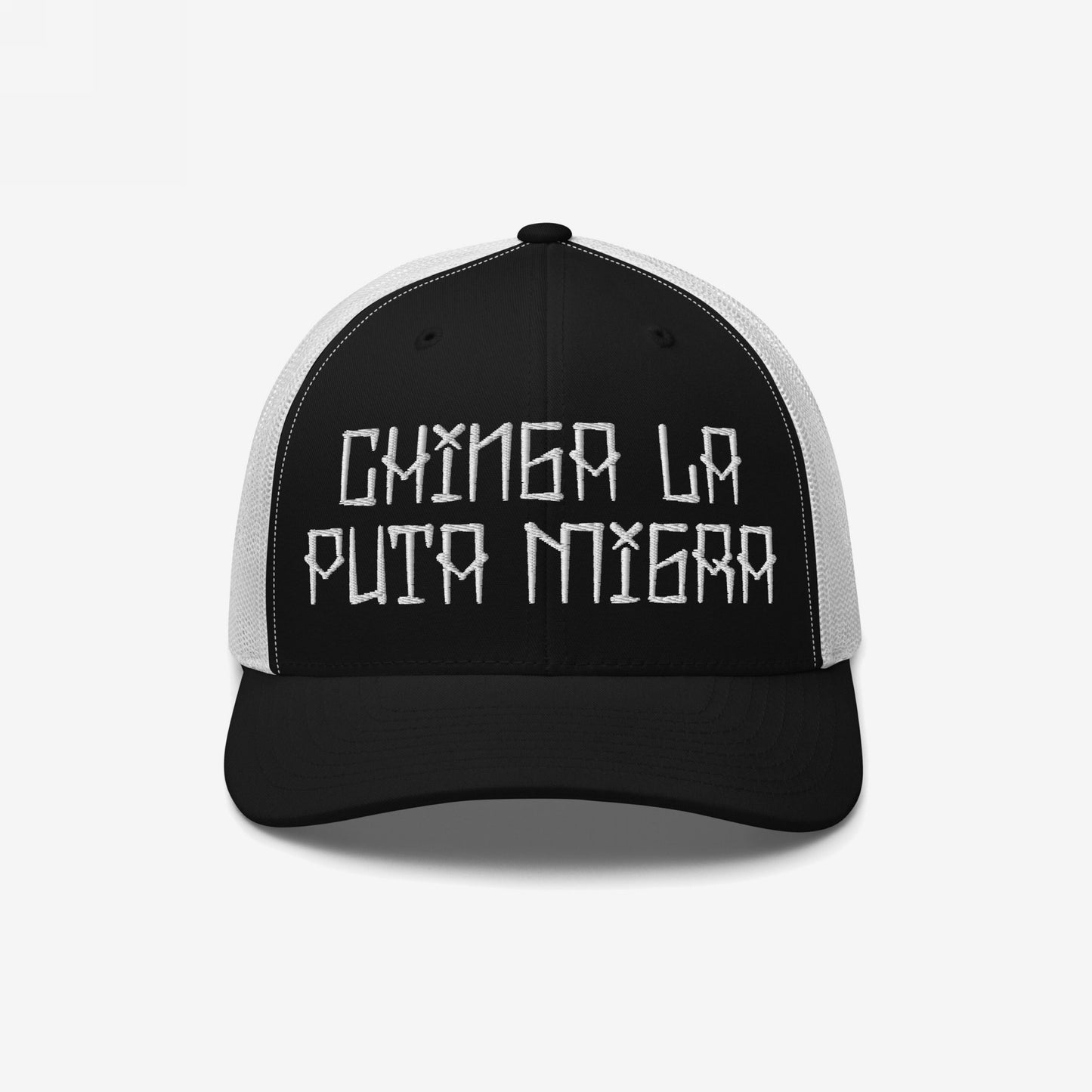 Trucker-style cap with Chinga La Puta Migra embroidered, symbolizing defiance against oppressive immigration systems. The black front contrasts with a white mesh back, embodying bold resistance and advocacy.
