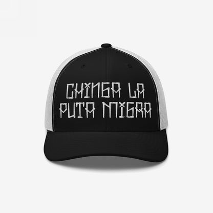 Trucker-style cap with Chinga La Puta Migra embroidered, symbolizing defiance against oppressive immigration systems. The black front contrasts with a white mesh back, embodying bold resistance and advocacy.