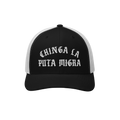 Chinga La Migra Hat features a black-and-white mesh trucker design with bold white Gothic embroidery, reading “CHINGA LA PI