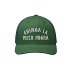 Dark green Chinga La Migra trucker hat with white Gothic text, mesh back, and curved brim, embodying anti-fascist sentiment a