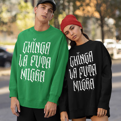 Two young adults model the Chinga La Migra Hoodie & Sweatshirt, featuring bold gothic lettering for a rebellious statement against oppression. The designs emphasize impactful streetwear with a defiant message.