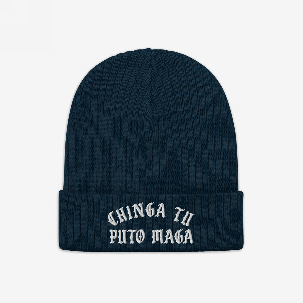 Dark-blue rib-knit beanie hat with CHINGA TU PUTO MAGA in white Gothic embroidery on the cuff, embodying anti-fascist and anti-MAGA sentiments, reflecting a stand against cruelty and inequality.