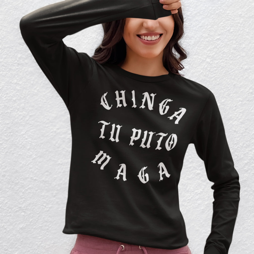 Person wearing Chinga Tu MAGA T-shirt in black with bold, white Old English text, smiling and partially covering eyes, against a plain background, embodying anti-fascist and protest sentiments.