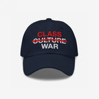 Class War Hat featuring “CLASS” above “WAR” with “CULTURE” crossed out, symbolizing a focus on economic justice over culture wars. Ideal for advocates of unity and systemic change.