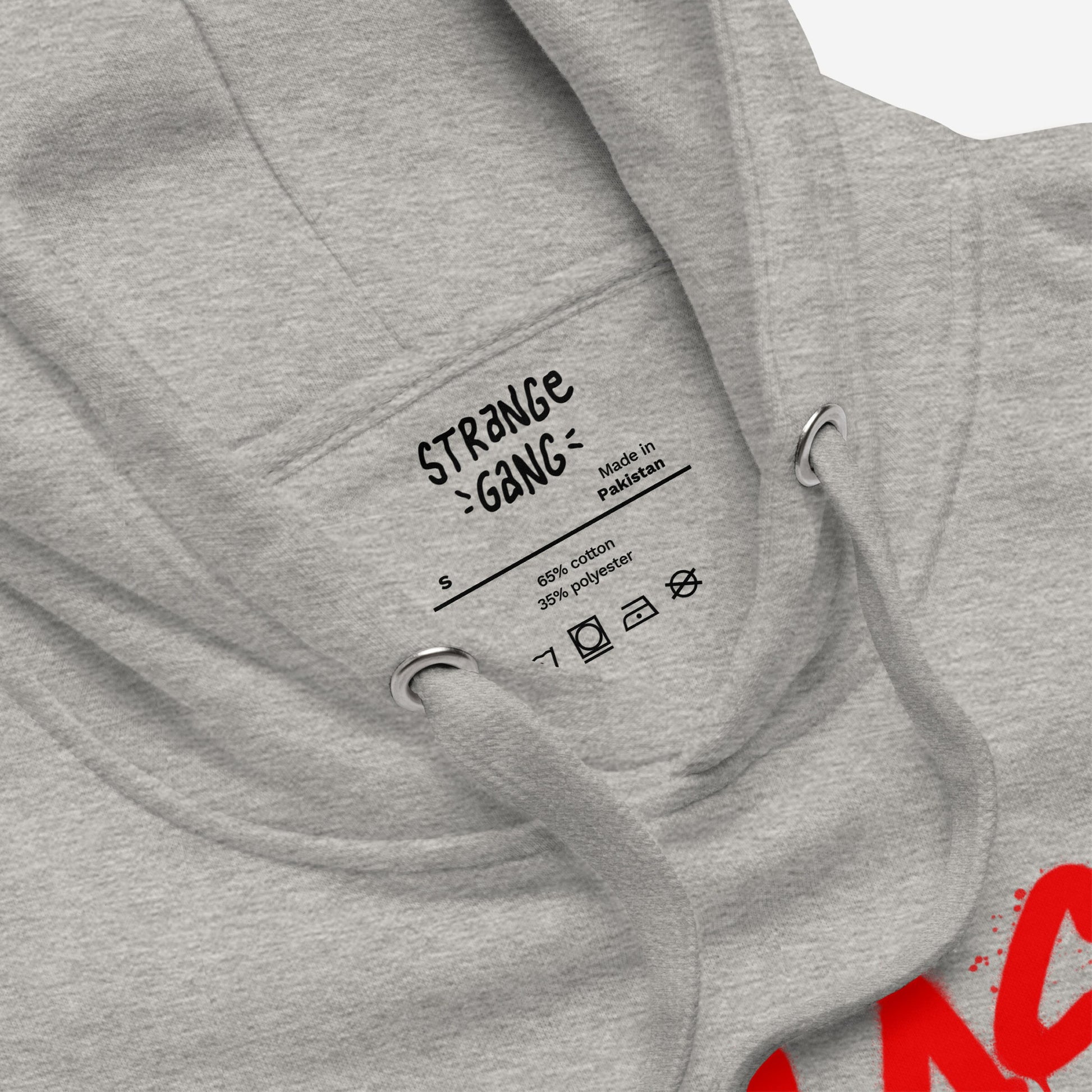 Close-up of the Class War Hoodie, showing the interior screen-printed label, metal eyelets, and drawstrings, emphasizing its raw, activist design with Class War scrawled over Culture War.