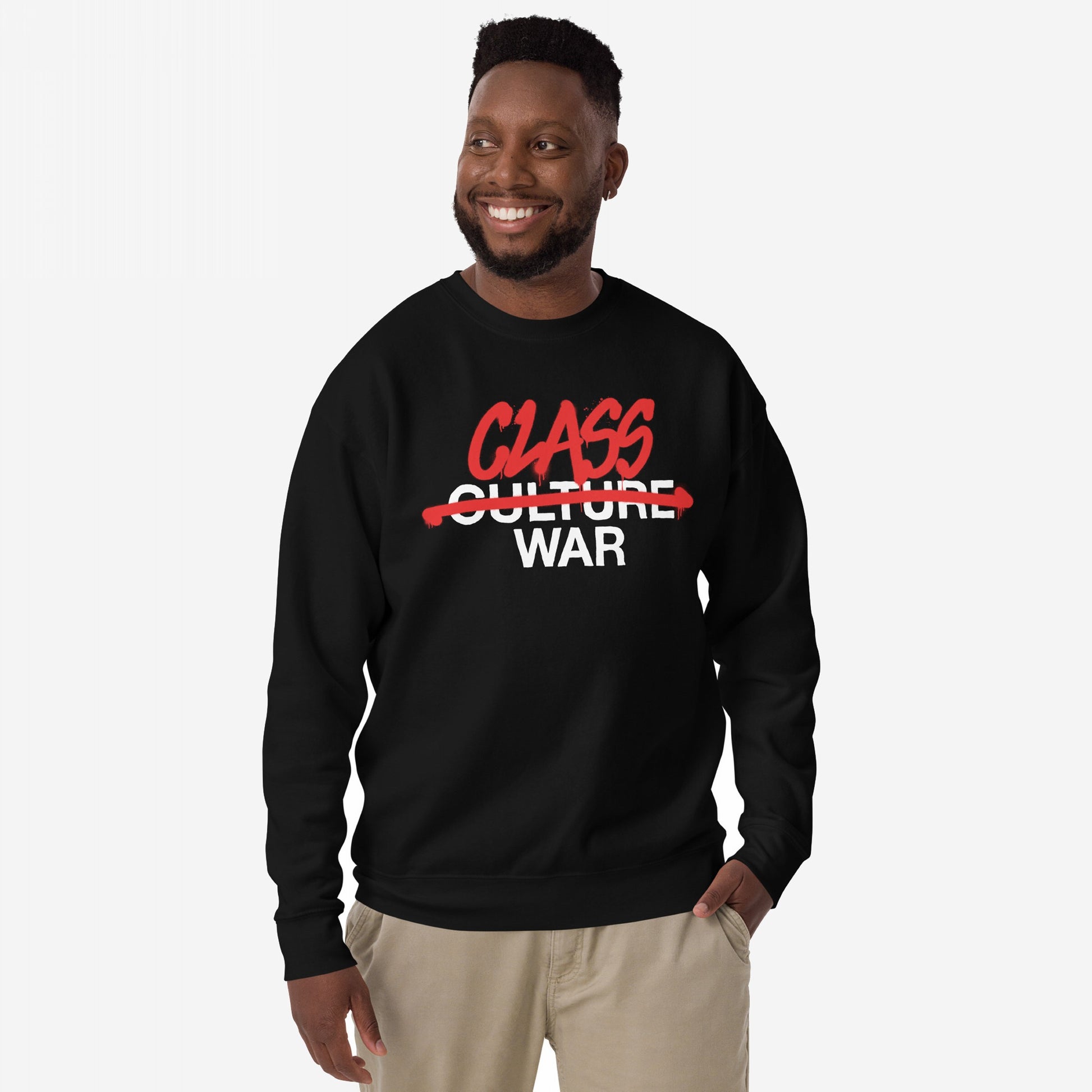 Man modeling the Class War Hoodie & Sweatshirt, featuring bold Class War slogan in graffiti style, striking through Culture War, embodying a message of socio-political awareness and activism.