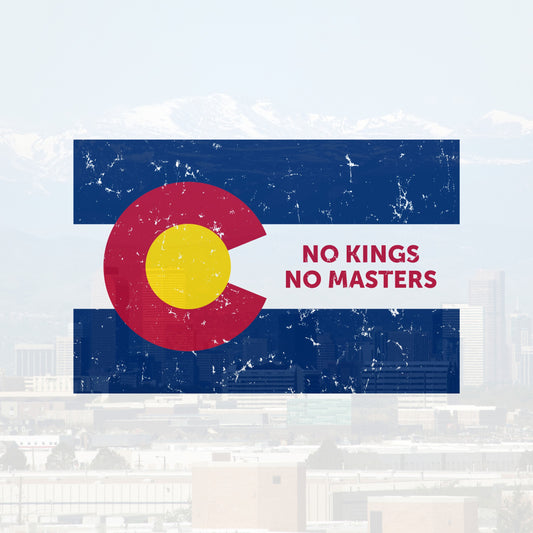 Colorado No Kings Flag Shirt: Distressed Colorado flag design with No Kings No Masters text, symbolizing rebellion and autonomy, overlaying a cityscape and mountains, supporting Colorado Immigrant Rights Coalition (CIRC).