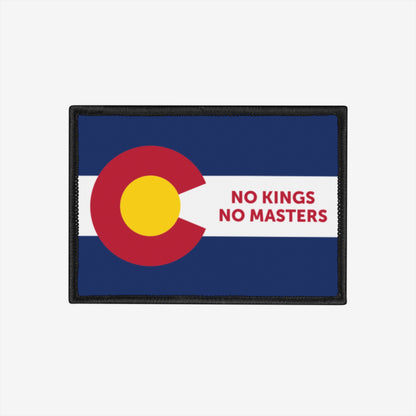 Colorado Flag No Kings Patch features a bold reinterpretation of the state flag with NO KINGS NO MASTERS in red, symbolizing self-governance. Ideal for expressing individualism and defying authority.