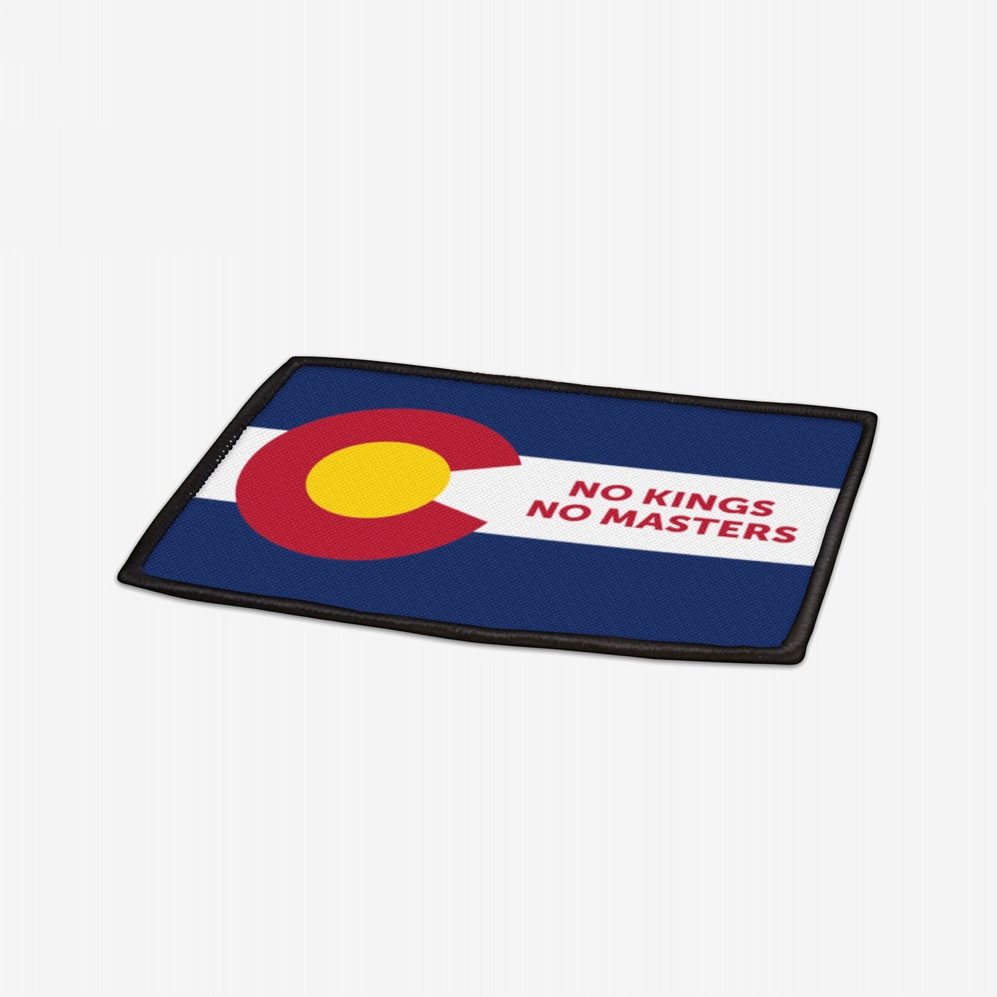 Colorado Flag No Kings Patch features a modified Colorado flag design with NO KINGS NO MASTERS in bold on the white stripe, symbolizing self-governance. Black-edged, 3.5x2.5, iron-on polyester patch.