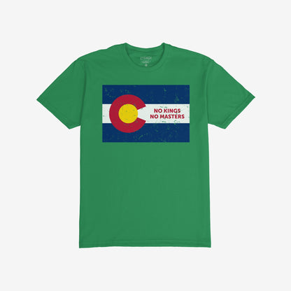 Green T-shirt featuring the Colorado No Kings Flag Shirt design, with a stylized Colorado flag and NO KINGS NO MASTERS slogan, embodying a rebellious spirit against authoritarianism.