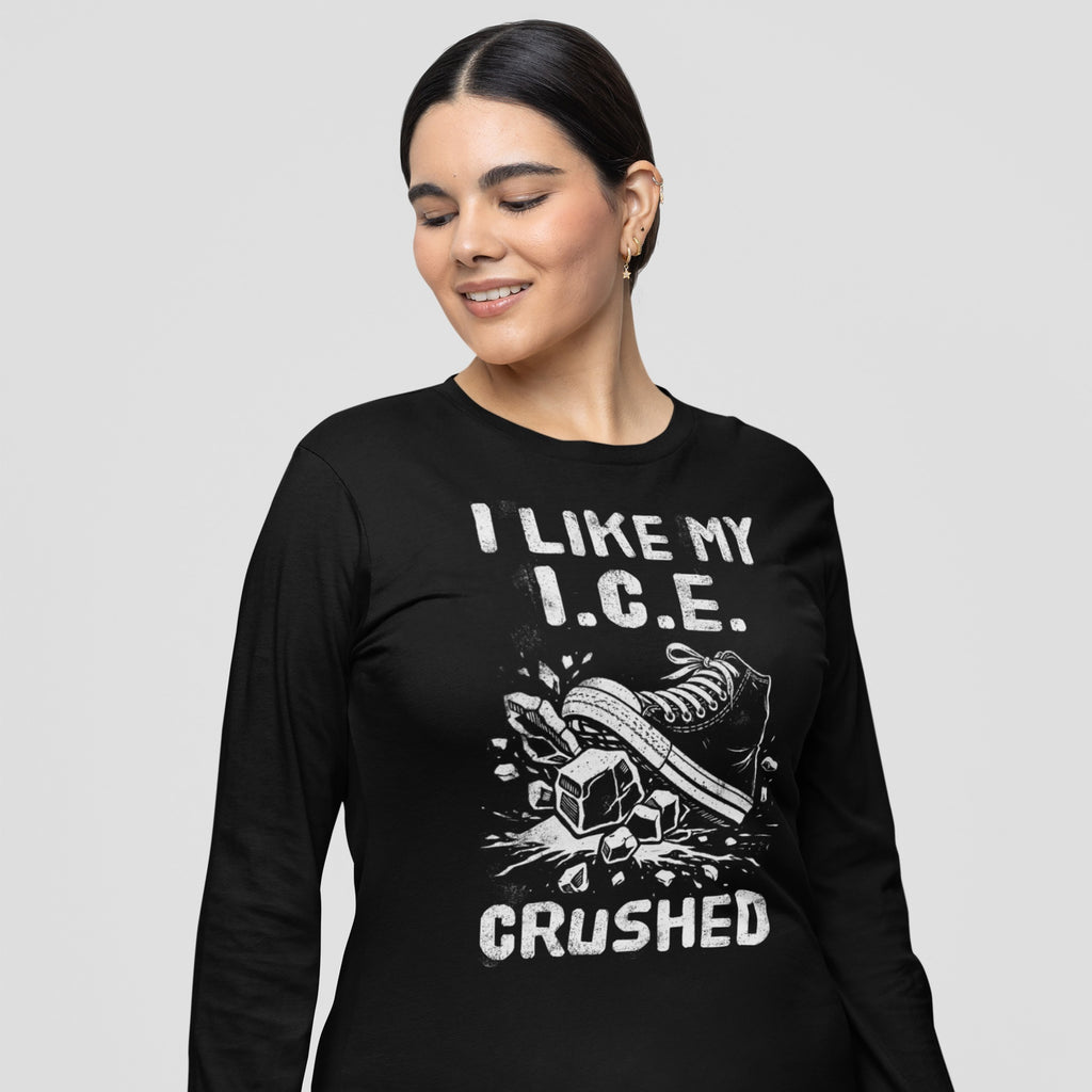 Person wearing Crushed ICE T-shirt featuring sneaker graphic smashing ice cubes with “I LIKE MY I.C.E. CRUSHED” text, symbolizing anti-ICE sentiment and supporting immigrant rights, against a light gray background.