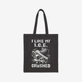 Crushed ICE Tote Bag featuring a sneaker stomping on ice cubes with I LIKE MY I.C.E. CRUSHED. printed, embodying an anti-fascist, pro-immigrant rights message. Made from durable cotton canvas.