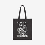 Crushed ICE Tote Bag featuring a sneaker stomping on ice cubes with I LIKE MY I.C.E. CRUSHED. printed, embodying an anti-fascist, pro-immigrant rights message. Made from durable cotton canvas.