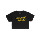 Crushin' Lagers Women's Baby Tee featuring bold yellow slogan on a plain black short-sleeve design, embodying retro varsity v