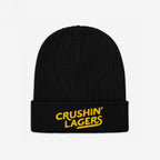 Black rib-knit beanie with CRUSHIN’ LAGERS embroidered in yellow on the cuff, celebrating lager lovers. Perfect for brewery visits and casual hangouts, designed with a retro touch for beer enthusiasts.