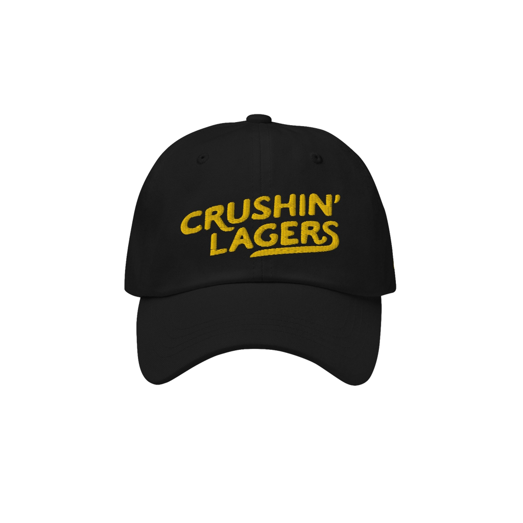 Crushin' Lagers Hat: Black unstructured baseball cap with CRUSHIN’ LAGERS in bold yellow, embracing lager culture for beer 