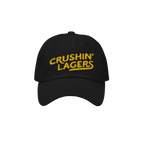 Crushin' Lagers Hat: Black unstructured baseball cap with CRUSHIN’ LAGERS in bold yellow, embracing lager culture for beer 
