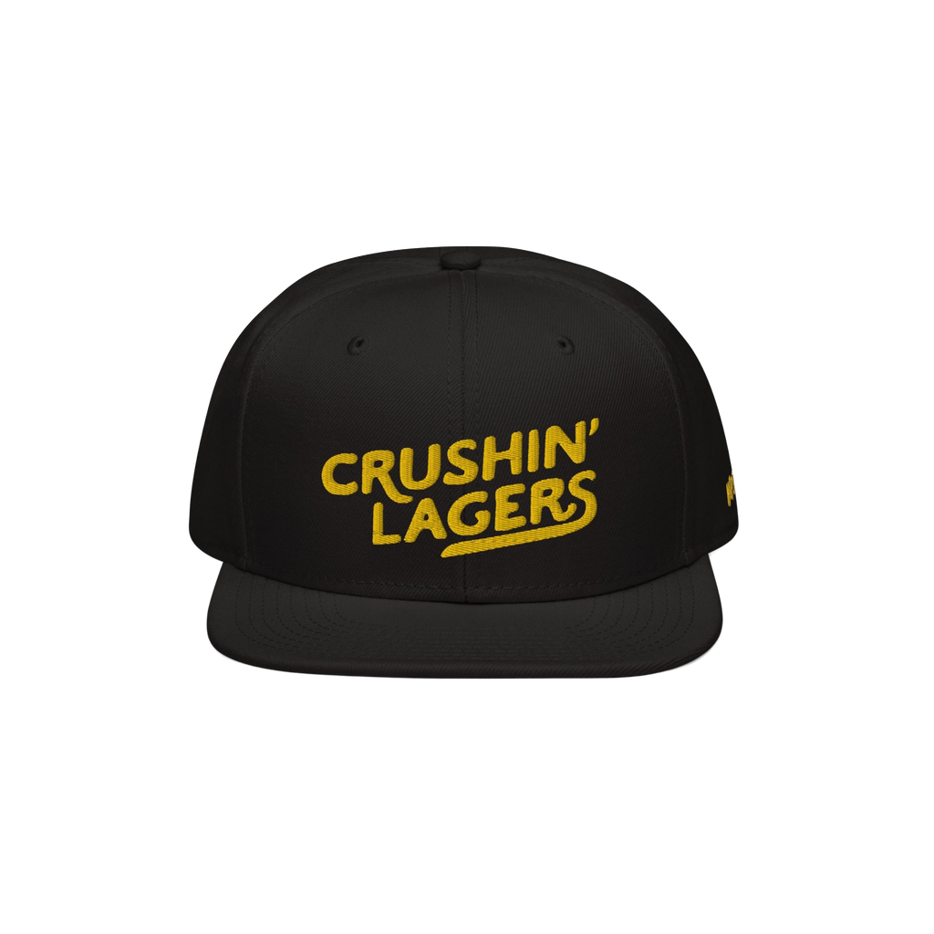 Crushin' Lagers Hat: This black snapback features a bold yellow CRUSHIN' LAGERS embroidery, celebrating lager enthusiasts wit