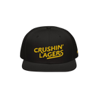 Crushin' Lagers Hat: This black snapback features a bold yellow CRUSHIN' LAGERS embroidery, celebrating lager enthusiasts wit