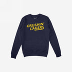 Navy-blue Crushin' Lagers Hoodie & Sweatshirt with bold yellow lettering, embodying a rebellious, pro-beer attitude. Cozy fleece design ideal for relaxed, carefree moments, perfect for bold, expressive comfort.