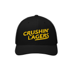 Crushin' Lagers Hat features a black mesh-back trucker design with bold yellow embroidery, curved visor, and snapback closure