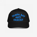 Custom Anti-Fascist 5-Panel Hat featuring bold blue TAMPA BAY ANTI FASCIST embroidery on the front, showcasing a structured design with a semi-curved visor and adjustable snapback for a comfortable, statement-making fit.