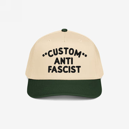 Custom Anti-Fascist 5-Panel Hat with a beige crown and green brim, featuring bold black embroidered text. Perfect for expressing your activism with customizable options for a personal touch.
