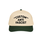 Custom Anti-Fascist 5-Panel Hat with a beige crown and green brim, featuring bold black embroidered text. Perfect for express