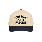 Custom Anti-Fascist 5-Panel Hat with light beige crown and navy bill, featuring bold black embroidered text and decorative as