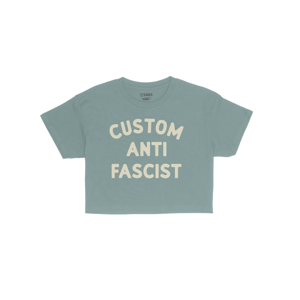 Custom Anti-Fascist Women's Baby Tee, featuring bold cream block letters on a short-sleeve crewneck, perfect for expressing a