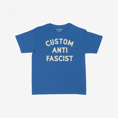 Custom Anti-Fascist Women's Baby Tee featuring bold CUSTOM ANTI FASCIST text. This cropped, fitted tee embraces activism with a vintage Y2K flair, ideal for expressing individuality and supporting equality.