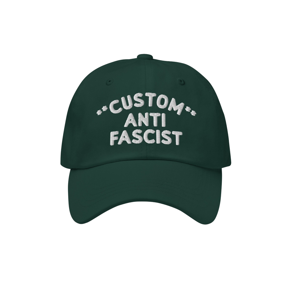 The Custom Anti-Fascist Dad Hat features a dark green design with white embroidery. This unstructured, low-profile cap showca