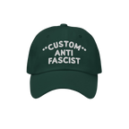 The Custom Anti-Fascist Dad Hat features a dark green design with white embroidery. This unstructured, low-profile cap showca