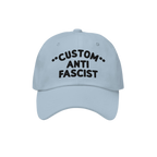 Light-blue Custom Anti-Fascist Dad Hat with black embroidered text. Features unstructured, low-profile design, pre-curved vis