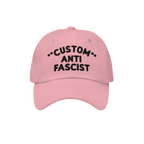 Pink Custom Anti-Fascist Dad Hat with black CUSTOM ANTI FASCIST embroidery, showcasing a bold statement in a relaxed, six-pan