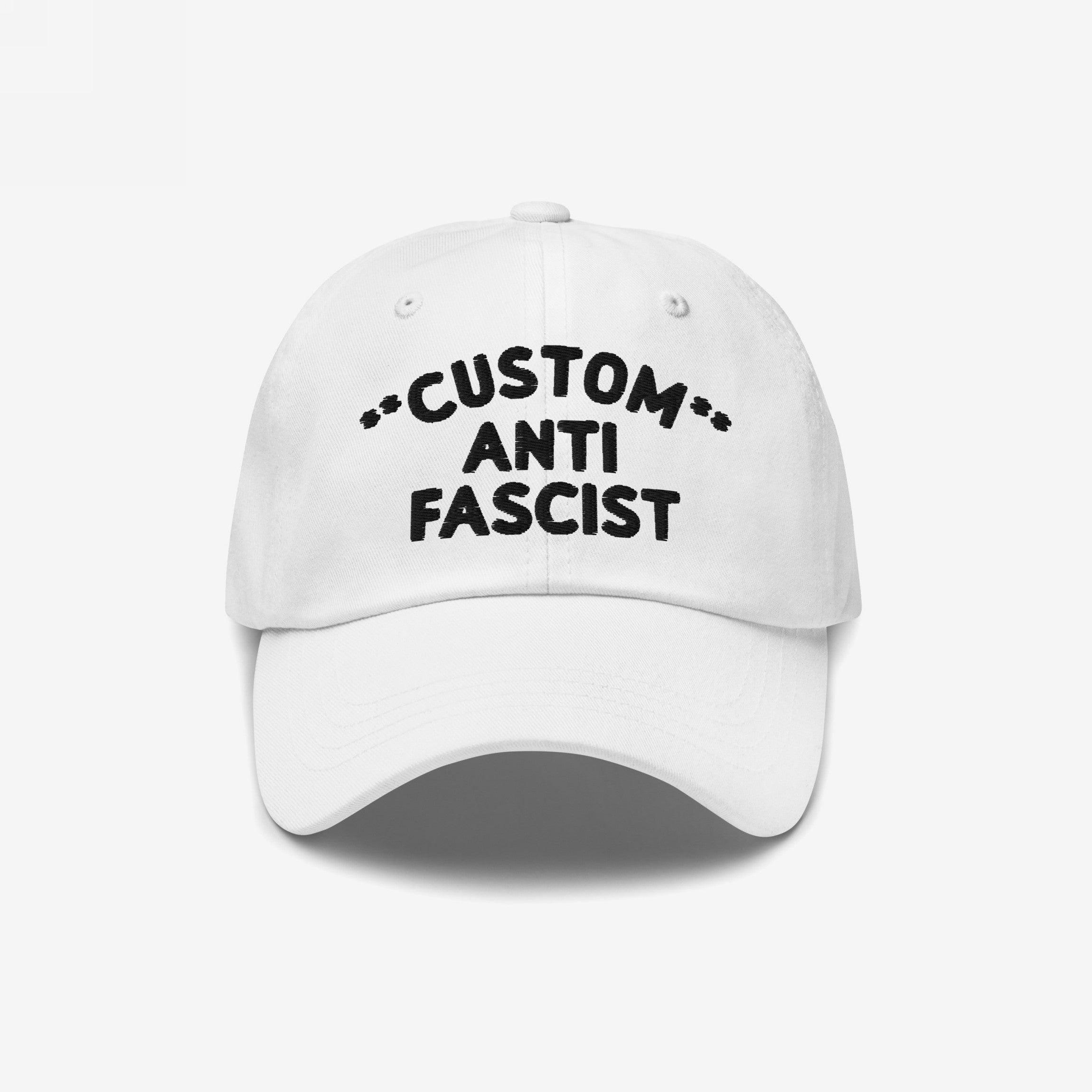 White Custom Anti-Fascist Dad Hat with black embroidered text, allowing personalization of the Custom text. This unstructured, low-profile cap features a pre-curved visor and adjustable back strap for a comfortable fit.