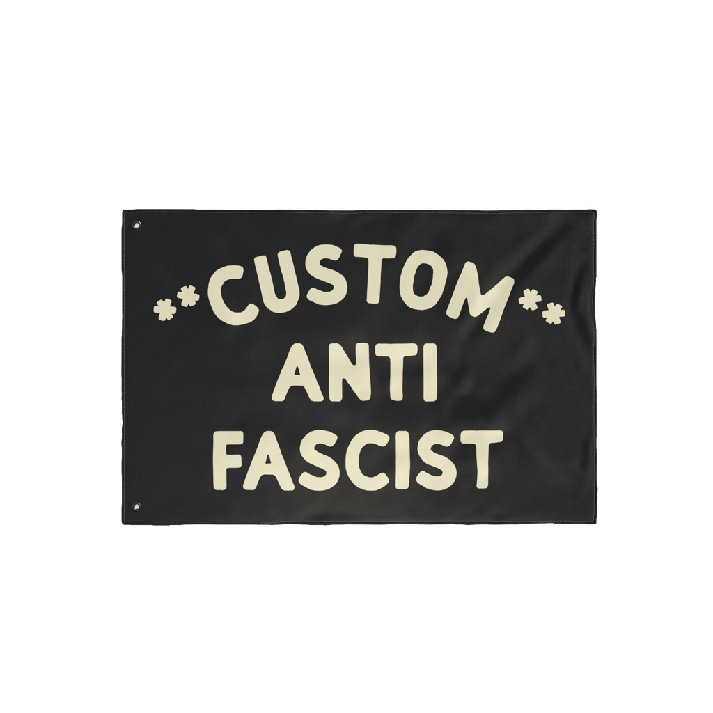 Custom Anti-Fascist Flag featuring bold, cream hand-drawn lettering with Custom arched above ANTI FASCIST and starburst symbo