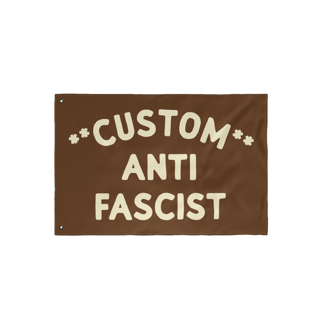Custom Anti-Fascist Flag featuring bold, cream-colored text on a durable brown banner with metal grommets, customizable to di