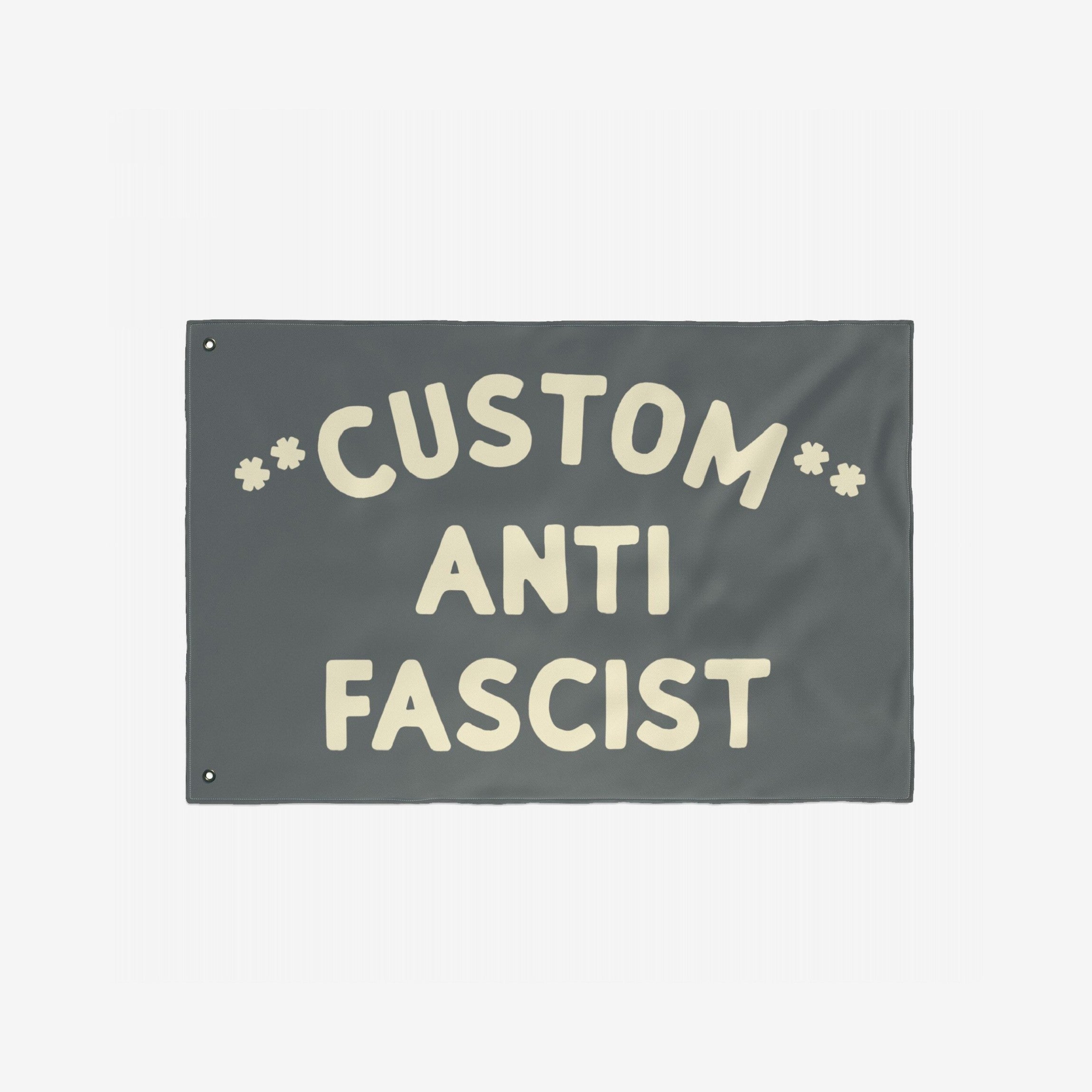 Custom Anti-Fascist Flag with cream text ANTI FASCIST and customizable top section, featuring metal grommets for easy hanging, ideal for promoting equality and standing against fascism.