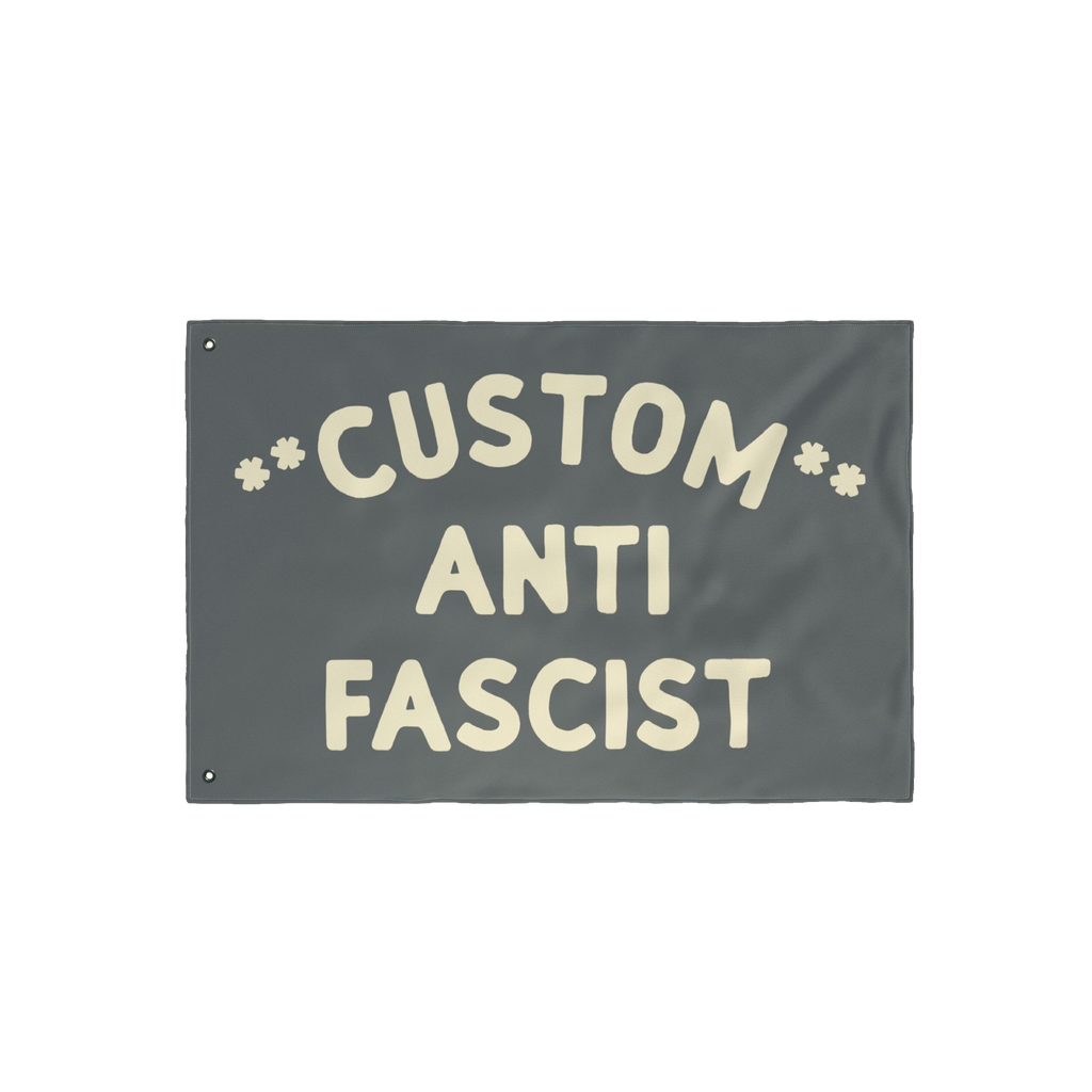 Custom Anti-Fascist Flag with cream text ANTI FASCIST and customizable top section, featuring metal grommets for easy hanging