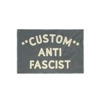 Custom Anti-Fascist Flag with cream text ANTI FASCIST and customizable top section, featuring metal grommets for easy hanging
