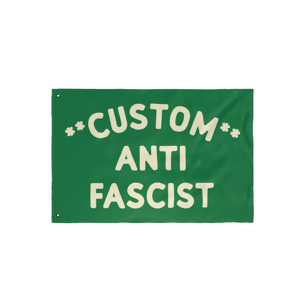 Custom Anti-Fascist Flag featuring bold cream text CUSTOM ANTI FASCIST with two metal grommets. Personalize with your message