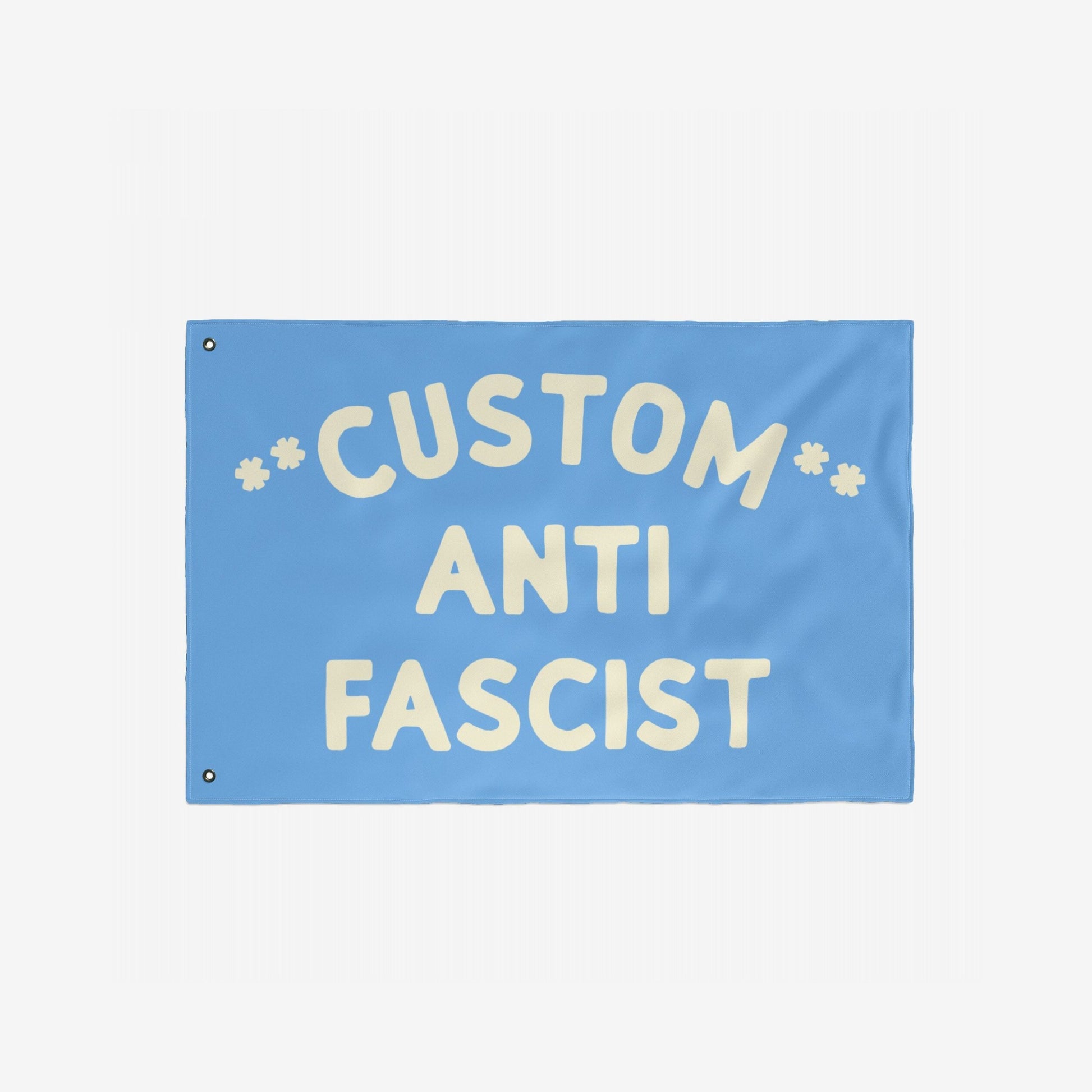 Custom Anti-Fascist Flag featuring large off-white text on a light-blue background, designed for visibility and impact. Personalized with your message, ideal for promoting equality and resistance against fascism.