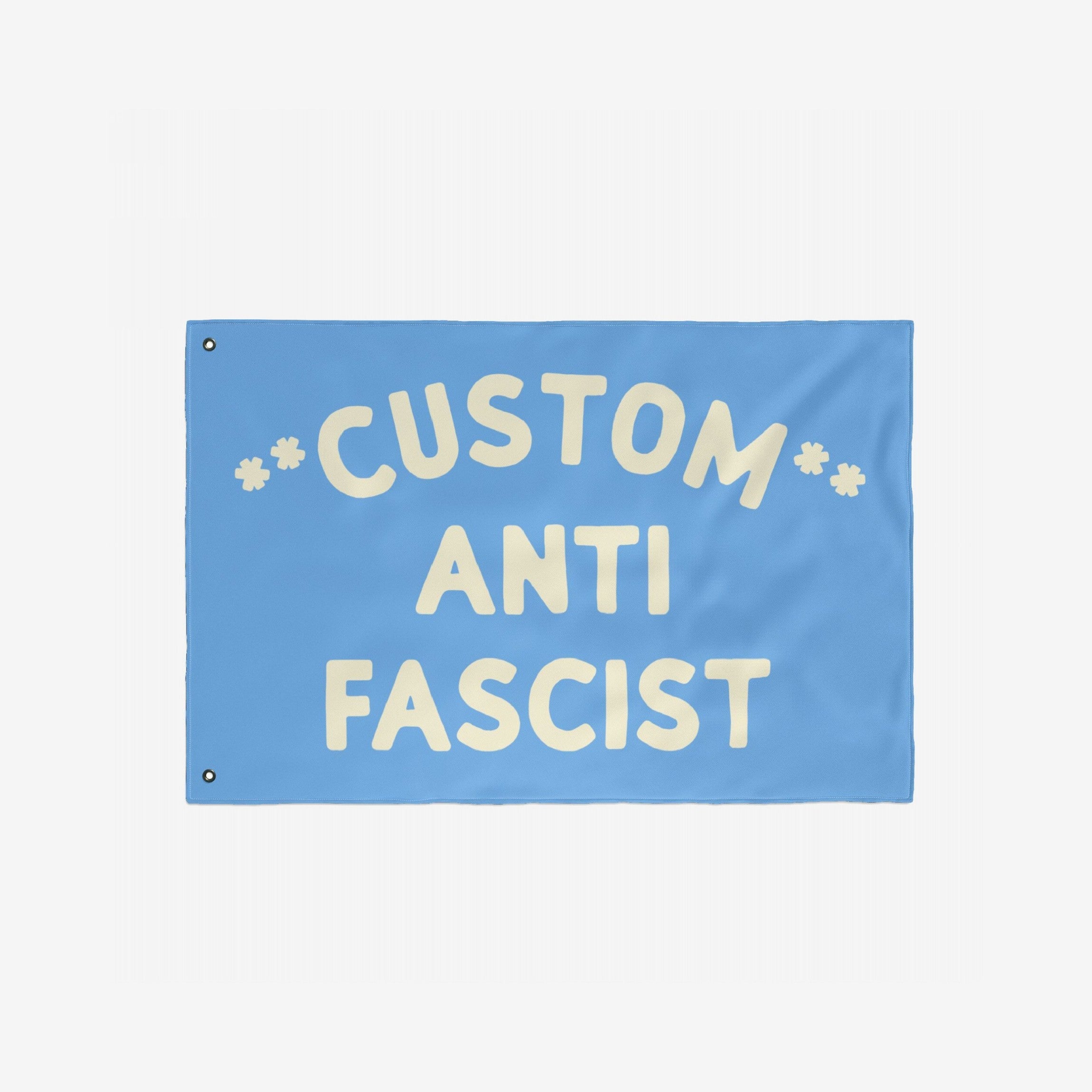 Custom Anti-Fascist Flag featuring large off-white text on a light-blue background, designed for visibility and impact. Personalized with your message, ideal for promoting equality and resistance against fascism.