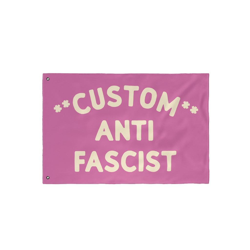 Custom Anti-Fascist Flag with bold cream letters on a pink background, featuring CUSTOM at the top, ANTI in the center, and F