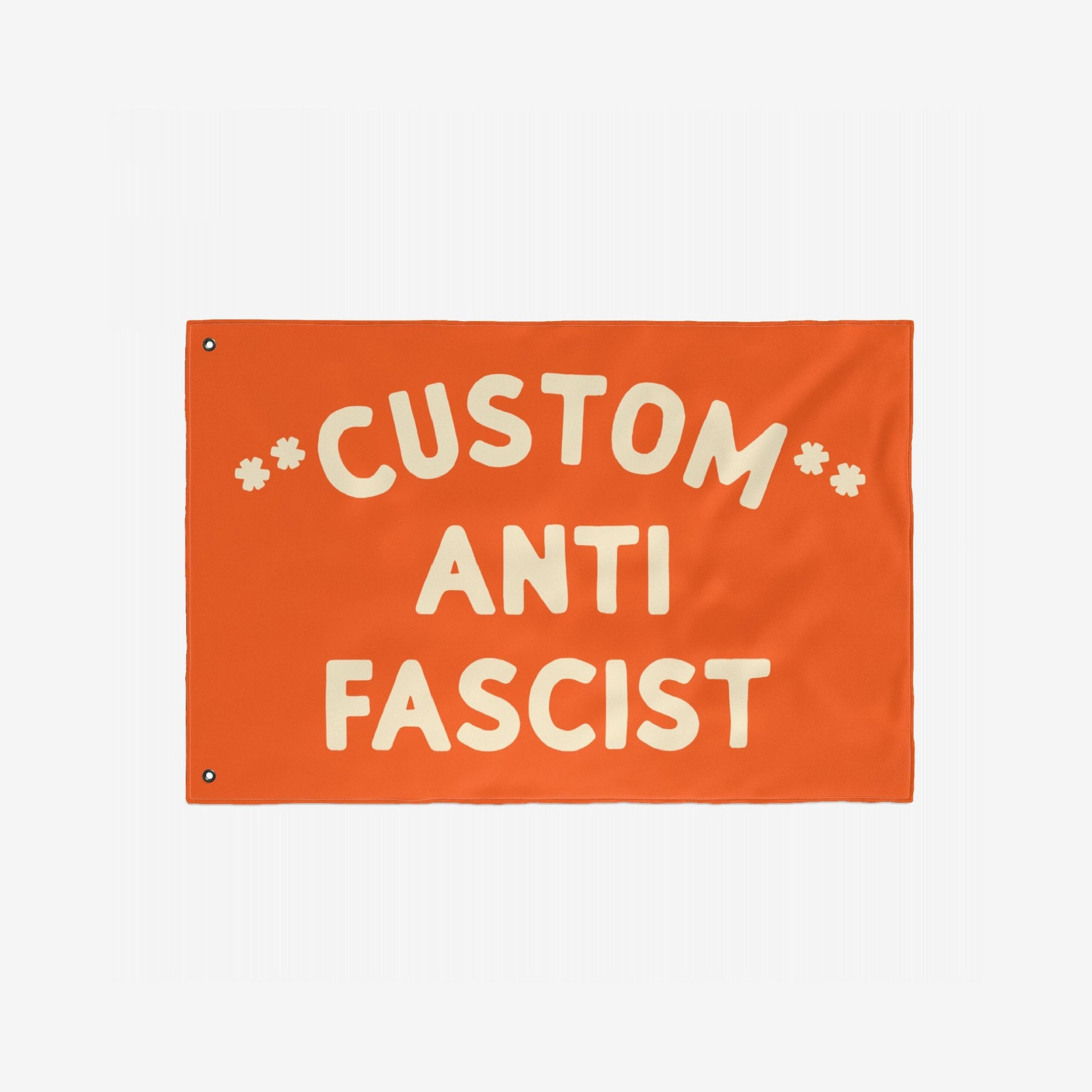 Custom Anti-Fascist Flag with bold cream letters, featuring CUSTOM ANTI FASCIST and metal grommets for hanging. Ideal for rallies or events, customizable message replaces CUSTOM for personalized activism.