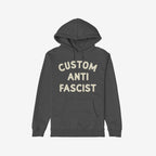 Custom Anti-Fascist Hoodie featuring bold off-white text on the chest. This dark charcoal-gray pullover includes a kangaroo pocket and hood, perfect for showcasing your values with style and comfort.